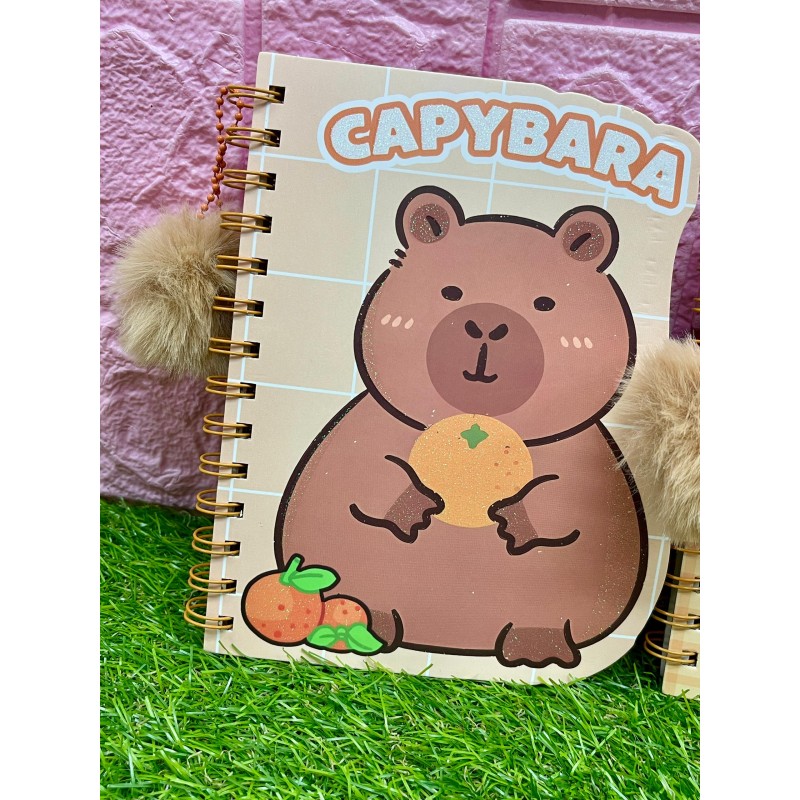 Libretas medianas tapa dura con pompon de capibara